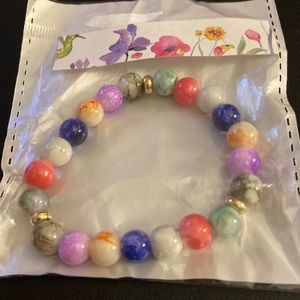 I am selling this beautiful bracelet. Colors are green, orange, purple and more.